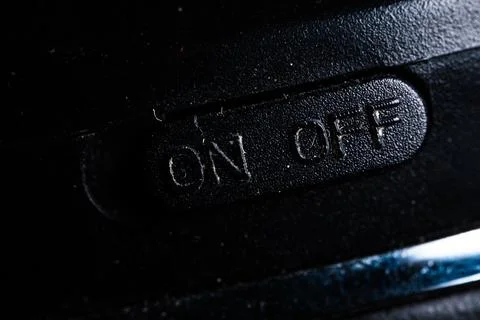 The on and off icon button is close on the device. Old and dirty Stock Photos