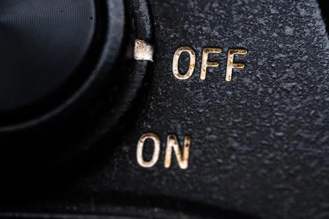 The on and off switch close on the camera. Old and dirty Stock Photos
