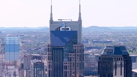 The AT and T or "Batman" building in central Nashville, Tennessee - rising Stock Footage 309539219
