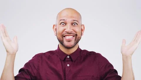 And thats a wrap folks. Studio shot of a young man making a funny face against a Stock Photos