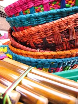 Andean flutes and baskets. Stock Photos