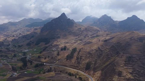 Andean mountain slopes showcasing landscape, winding roads and agricultural 스톡 동영상 308408653