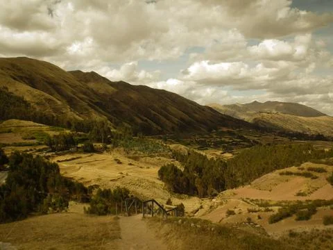 Andean valley under a cloudy sky. Stock Photos