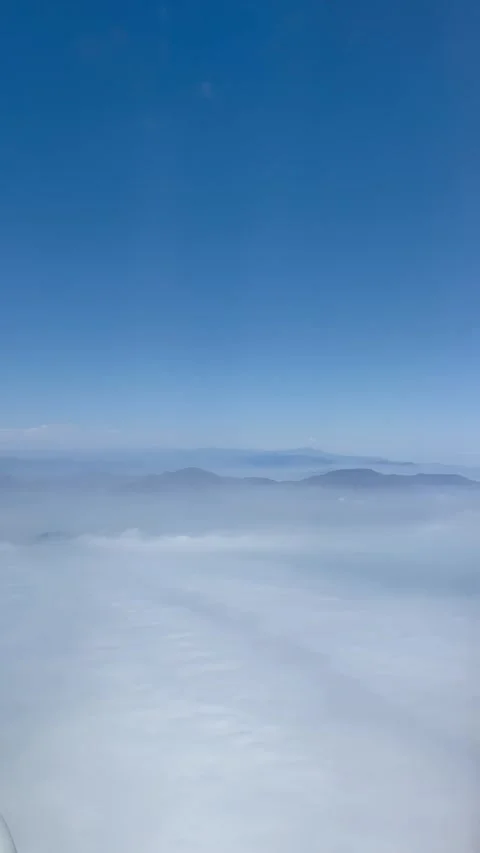 Andes mountains covered by white clouds, airplane window view, Peru Stock Footage 266593203