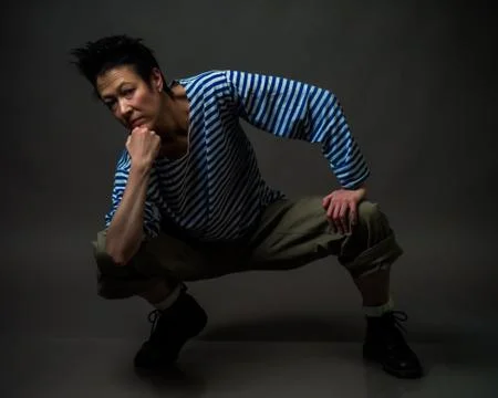 Androgynous character in a striped vest Stock Photos