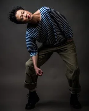 Androgynous character in a striped vest Stock Photos