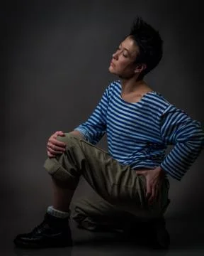 Androgynous character in a striped vest Stock Photos