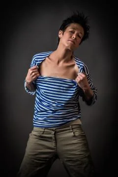 Androgynous character in a striped vest Stock Photos
