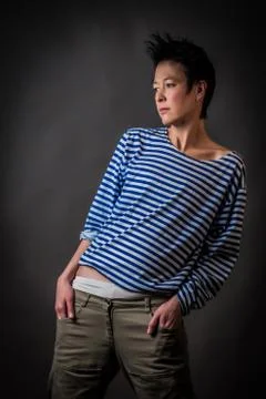 Androgynous character in a striped vest Stock Photos