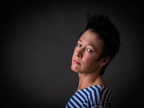 Androgynous character in a striped vest Stock Photos