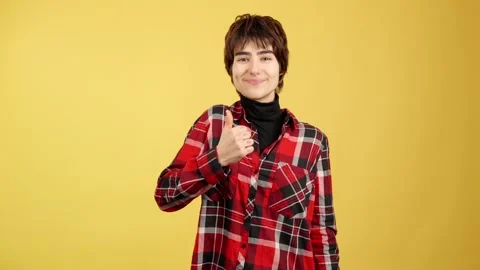 Androgynous person gesturing approval with the thumb up Stock Footage 234119811