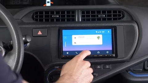 Android Auto on Display Settings Inside the Interior of a Car Stock Footage 91138854