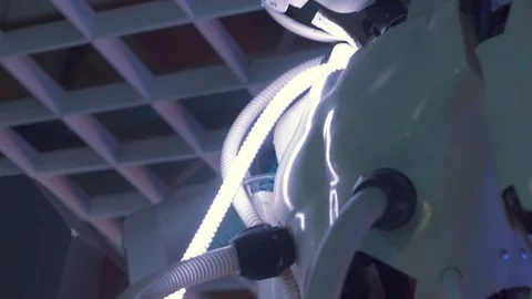 Android Humanoid Robot connected with luminous tubes, imitation of a living orga 스톡 동영상 98821669
