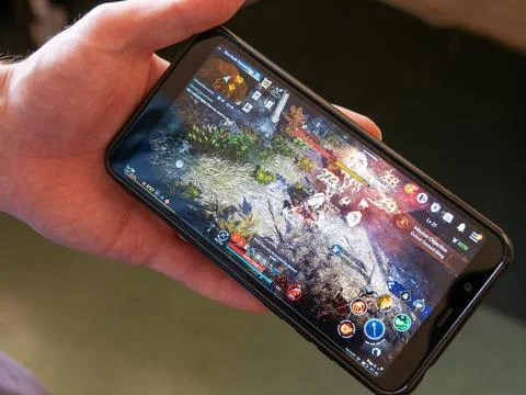 A android mobile phone in the hands of a white man. Stock Photos