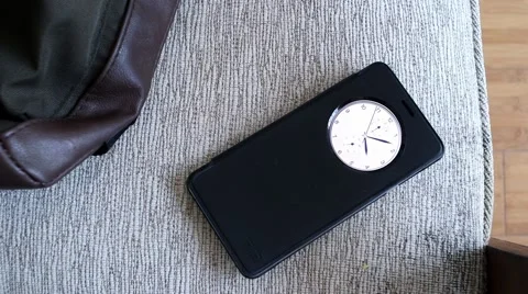 Android smartphone on chair with bag Видео 63982705