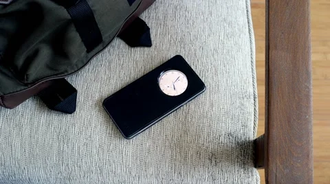 Android smartphone on chair with bag Stock Footage 63982761