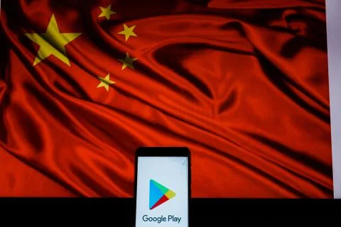 Android-smartphone that shows the Google Play logo in front of the China flag Stock Photos