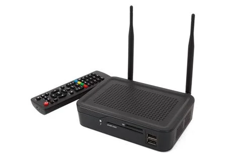Android TV set top box receiver Android TV set top box receiver with remot... Stock Photos