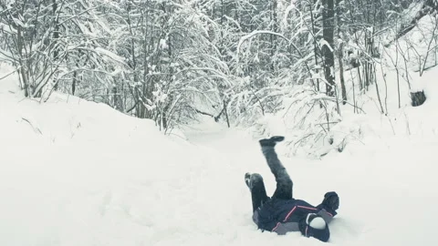 Android walks in snow. He falls, stands up. Parody of robots Video stock 147633316