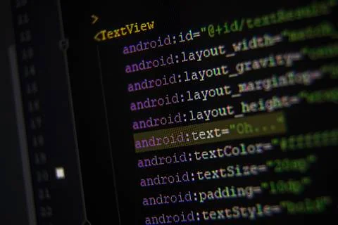 Android xml code on monitor screen from side Stock Photos