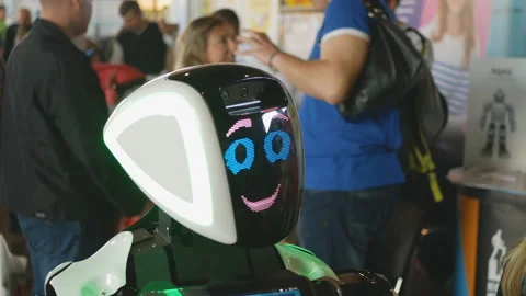 Android,robot communicates with people. Cyborg among people Stock Footage 118427685