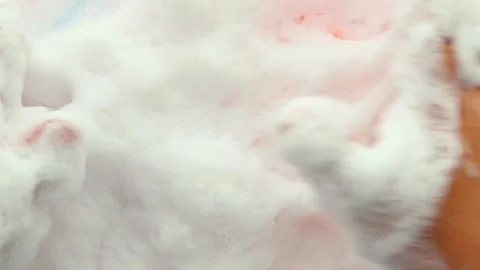 Ands gently squeeze sponges in the foam with a soothing effect of Asmr. Part 2 Stock Footage 280957009