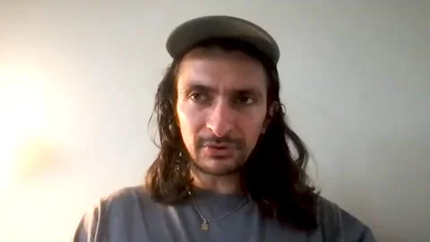Aneil Karia is interviewed online for his new movie, 'Surge' - 2021 Video stock 154346799