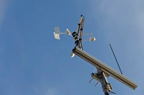 Anemometer and wind vane on blue sky Stock Photos