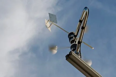 Anemometer and wind vane on blue sky Stock Photos
