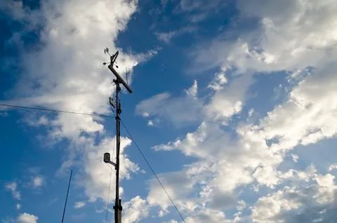 Anemometer and wind vane on blue sky Stock Photos