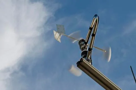 Anemometer and wind vane on blue sky Stock Photos