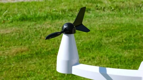 Anemometer measuring wind direction outdoors on a green grass background Stock Footage 346244787