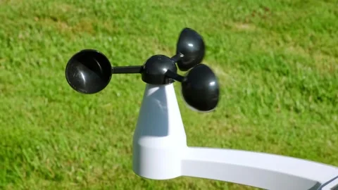 The Anemometer measuring wind speed outdoors on a green grass background Stock Footage 346215668