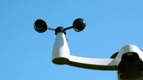 The Anemometer measuring wind speed outdoors on a blue sky background. Weather Stock Footage 346244840