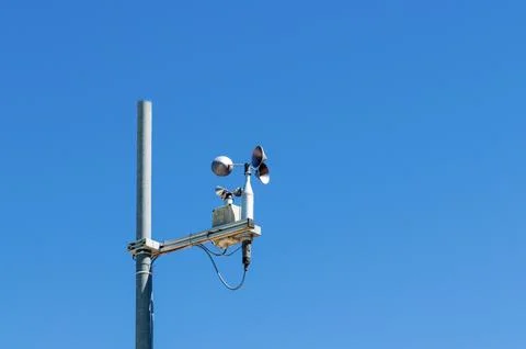 Anemometer wind gauge sensor on weather station with blue sky Stock Photos