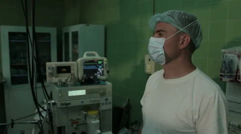 Anesthetist controls the condition of the patient during surgery. Video stock 50968313