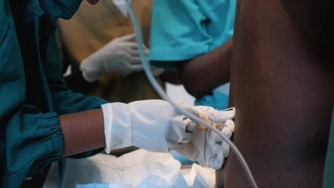 The anesthetist performs spinal anesthesia. Stock Footage 126394991