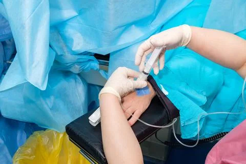 Anesthetize the patient during surgery. Stock Photos