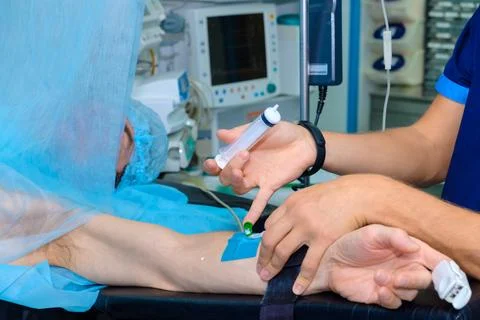 Anesthetizing the patient during surgery. Stock Photos