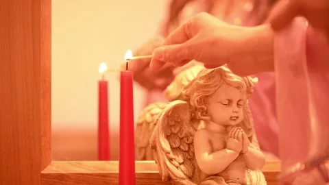 Angel and candle on table 스톡 동영상 133714361