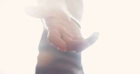 Angel appears with open hand reaching out for you to join in the afterlife Stock Footage 100585433