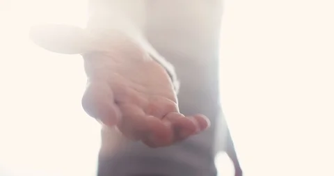 Angel appears with open hand reaching out for you to join in the afterlife Stock Footage 100585444