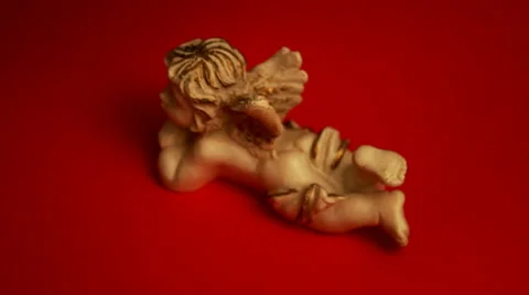 Angel Figurine. Red background. Stock-Footage 37186927