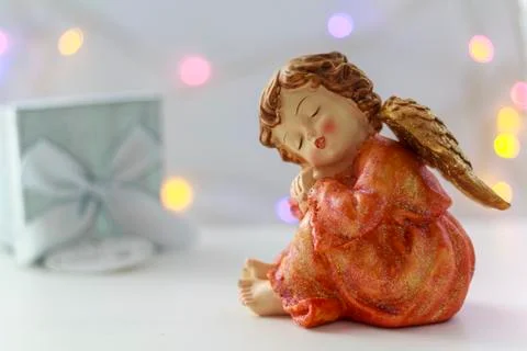 Angel with gift box on the background Stock Photos