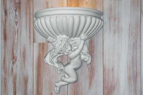 Angel holding shell Stock Photos