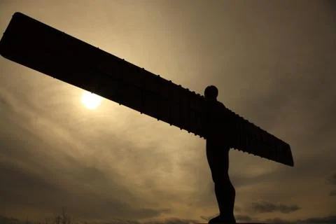 Angel of the North silhouetted against the sky Stock Photos