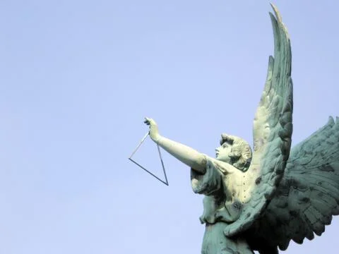 Angel playing a Triangle Stock Photos