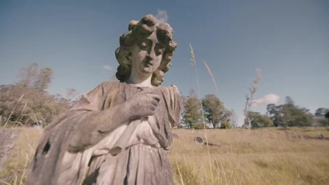 Angel statue headstone with broken off arm. Auckland,  New Zealand Stock Footage 261829641