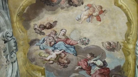 Angels in the clouds painted on the ceiling of catholic church Stock Footage 70915666