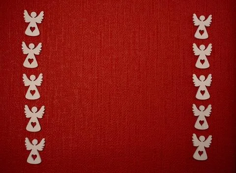 Angels on a red background,  there is a blank space to write a message. Stock Photos